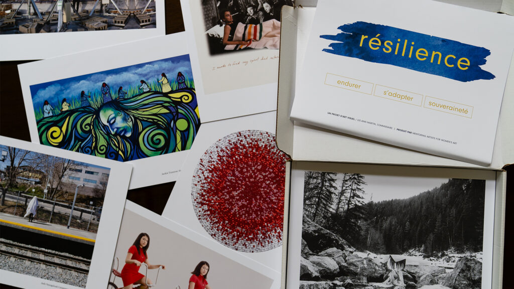 Beautiful artwork made by Indigenous artists across Canada is spread out across a table.